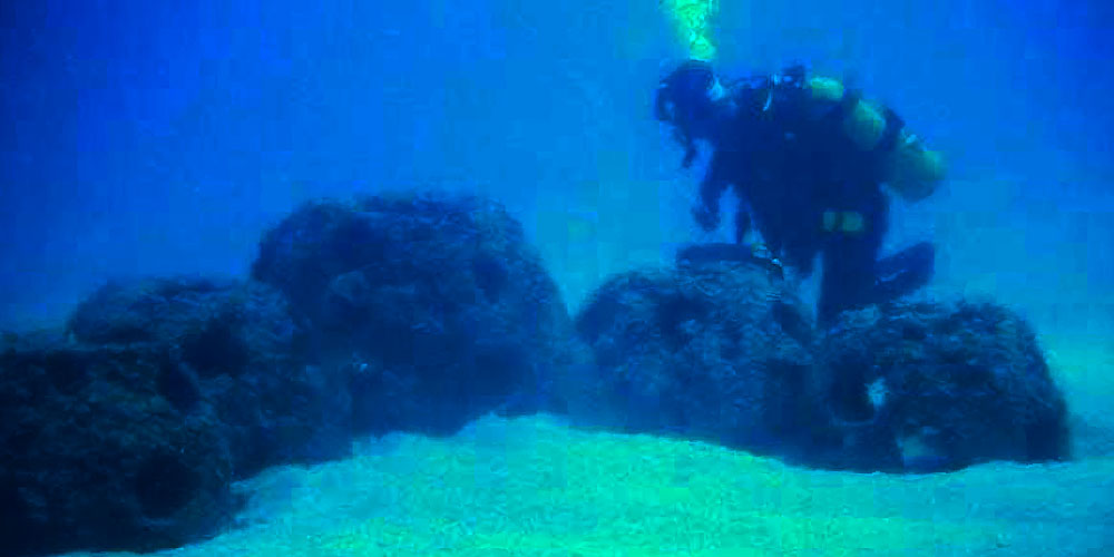 image of reef balls and diver under water